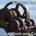 All you see are the cogs. But, they are part of a winch which is part of a crane. Systems in systems in systems.